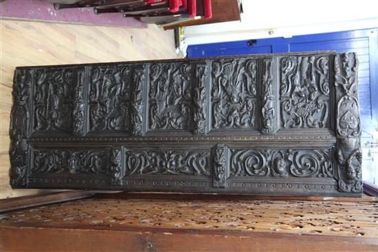 A 17th century Flemish carved oak coffer front, overall 5ft 7in. x 2ft 3in.